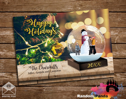 Gold Holiday card with snowman in a globe, Christmas lights, and 'Happy Holidays' text on a wooden background.
