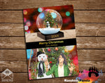 Christmas card with a snow globe and people on a wooden background, featuring the brand 'Random Panda'.